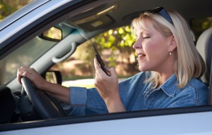 Woman Text Messaging While Driving